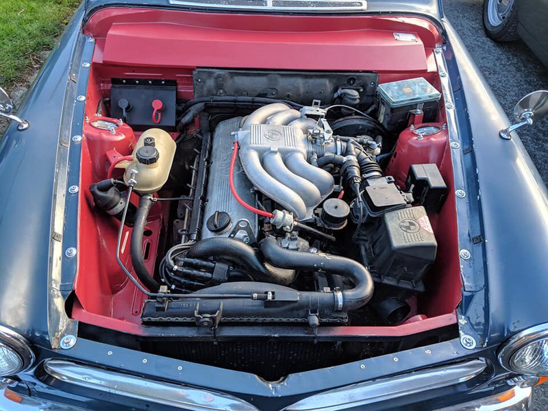 Illustration for article titled True Hero Swapped A Volvo Amazon Wagon Body Onto A BMW E30 In His Driveway